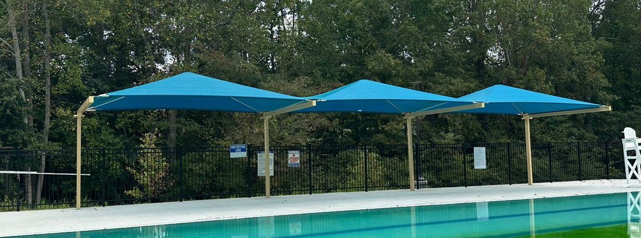 Slide Beam canopy over a community pool